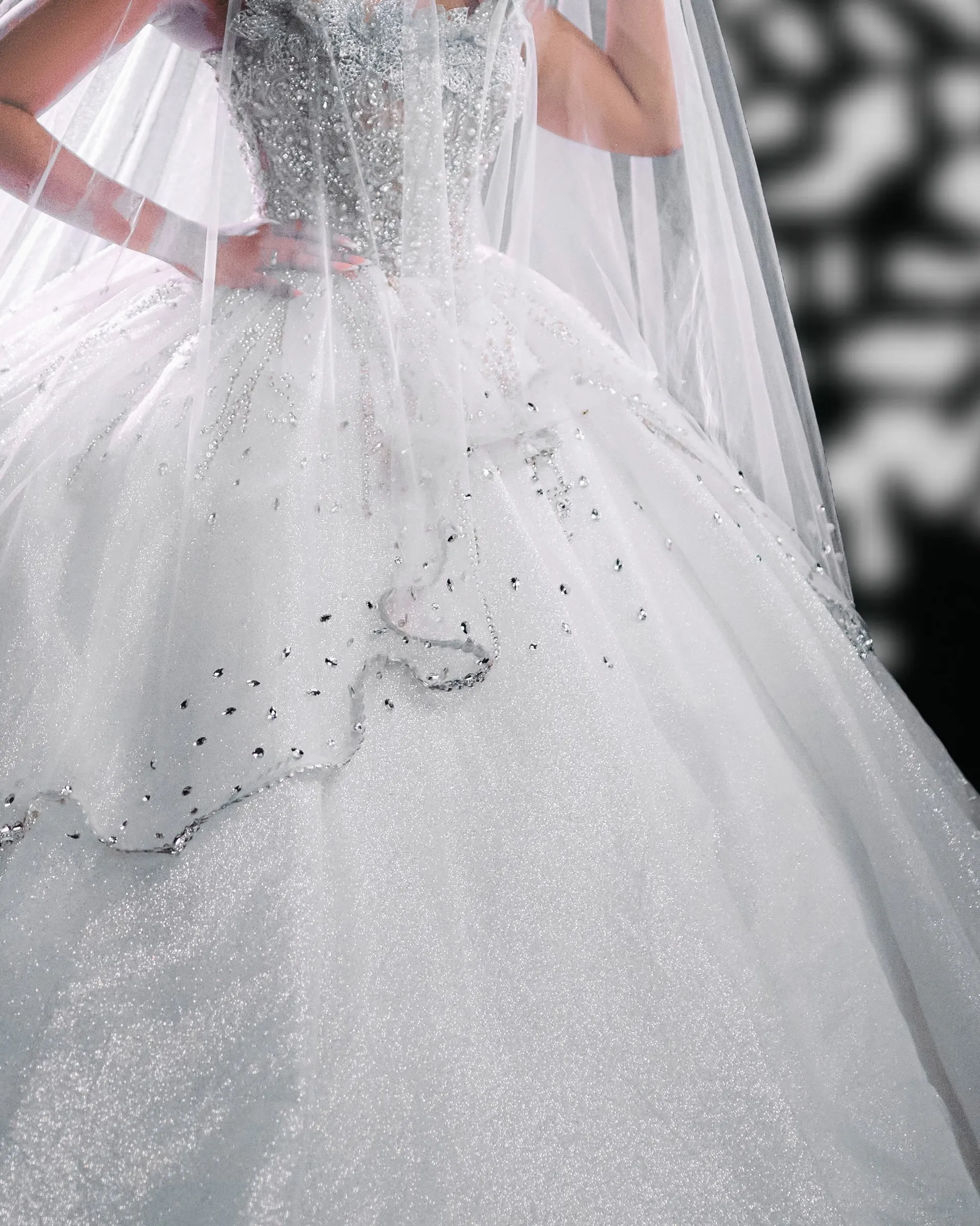 Crystal scatter on the tulle of the Look II ball gown