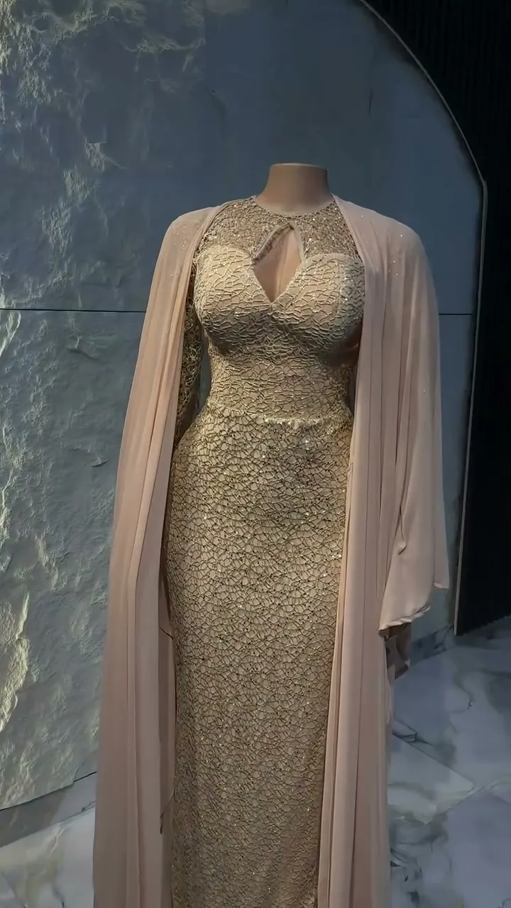 The keyhole neckline of the champagne beaded gown
