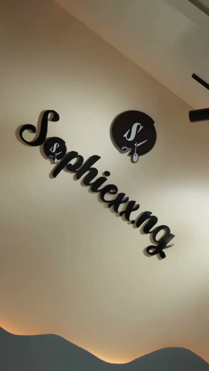 The Sophiexx.ng sign on the studio wall