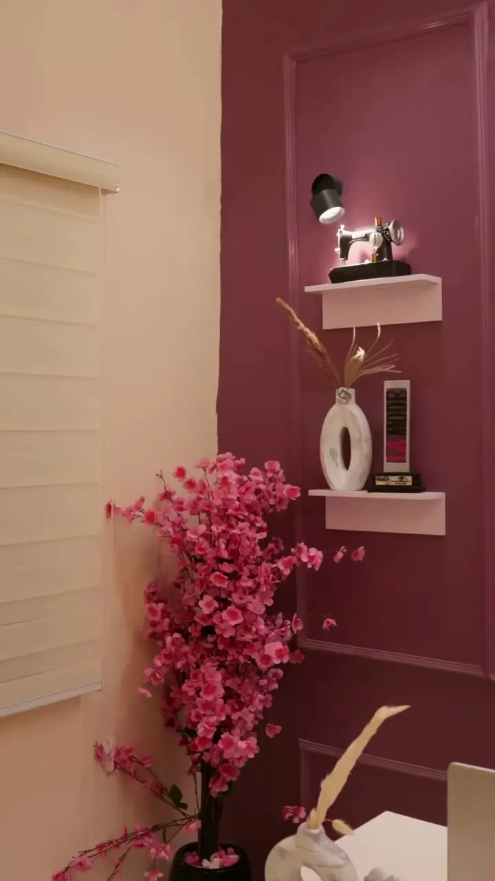 A styled corner of the fashion house with pink blossoms