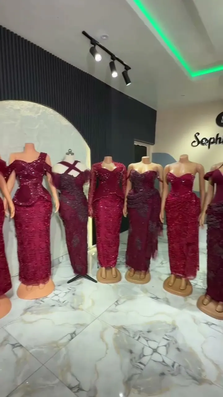 Wine sequin asoebi gowns on mannequins in the studio